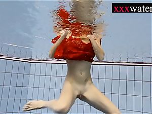 super-sexy sizzling dame swimming in the pool
